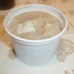 Truite saumonée au four en croûte de noisettes et compotée d'échalotes